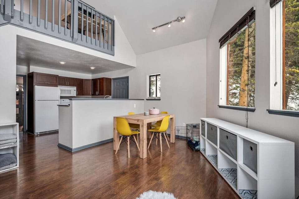 Open dining and kitchen with large windows