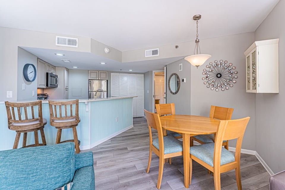 2 bar height chairs and 4 chair table. 