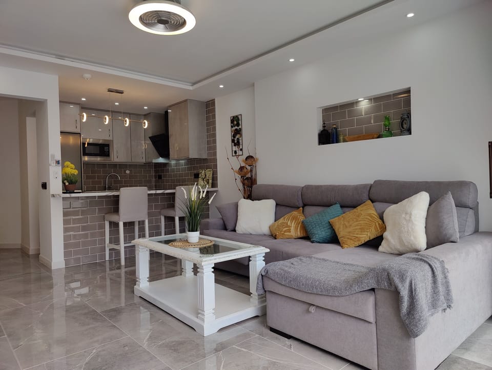 Living room with small coffee table where you can relax in the evening to watch TV or a movie