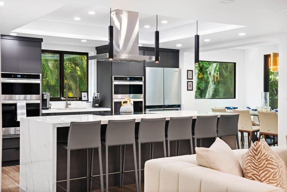Sleek gourmet kitchen with double ovens