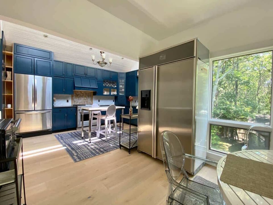 Sunny and spacious kitchen with chef dual fuel range.