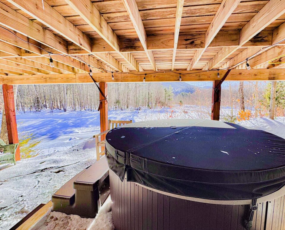 Warm up and unwind in the hot tub, tucked beneath the deck — the perfect winter retreat!