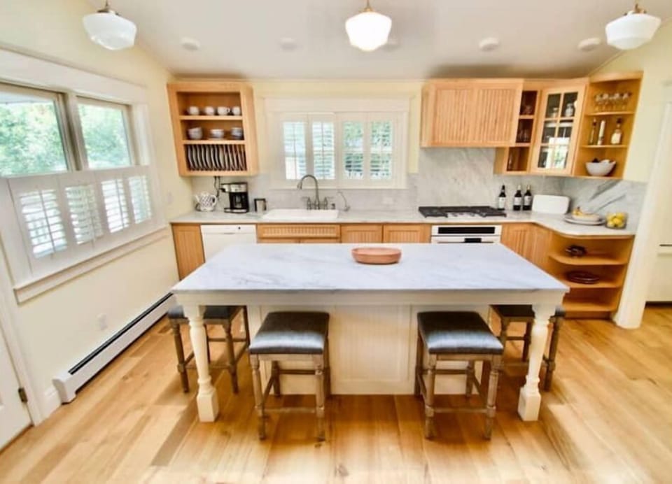 Kitchen with pantry open.