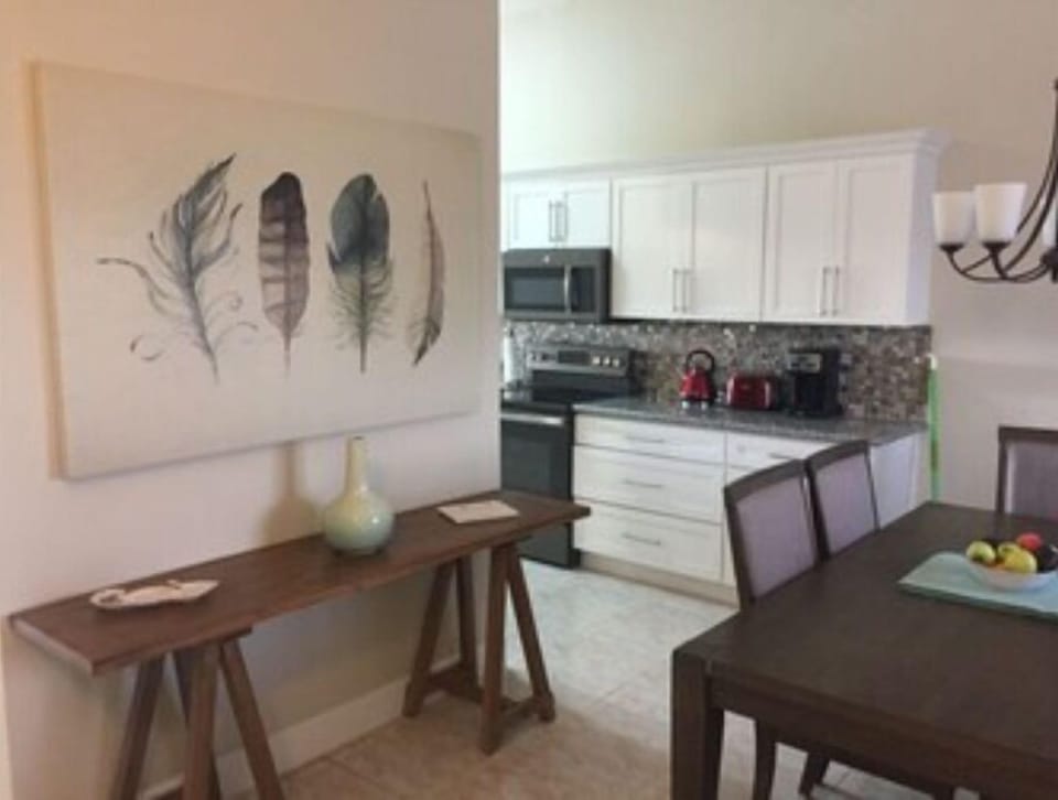 Front hall view , dining room and kitchen view.  