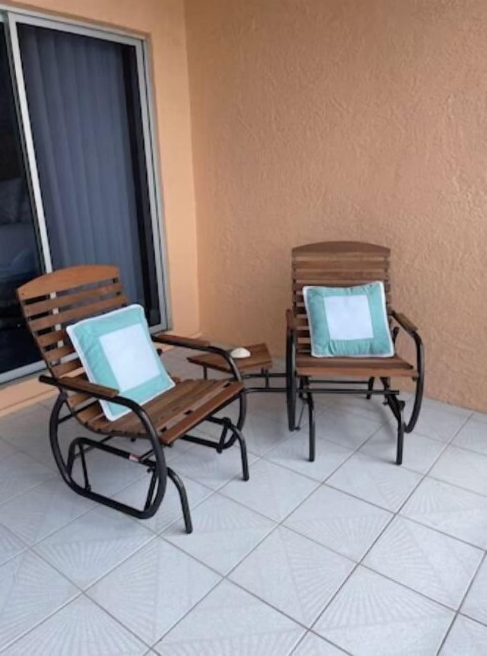Rocking chair set on balcony overlooking the canal and ocean