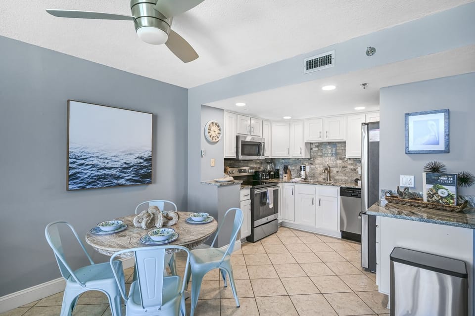 Your coastal-inspired kitchen and dining space combines seaside charm with modern convenience, perfect for preparing meals and gathering together.