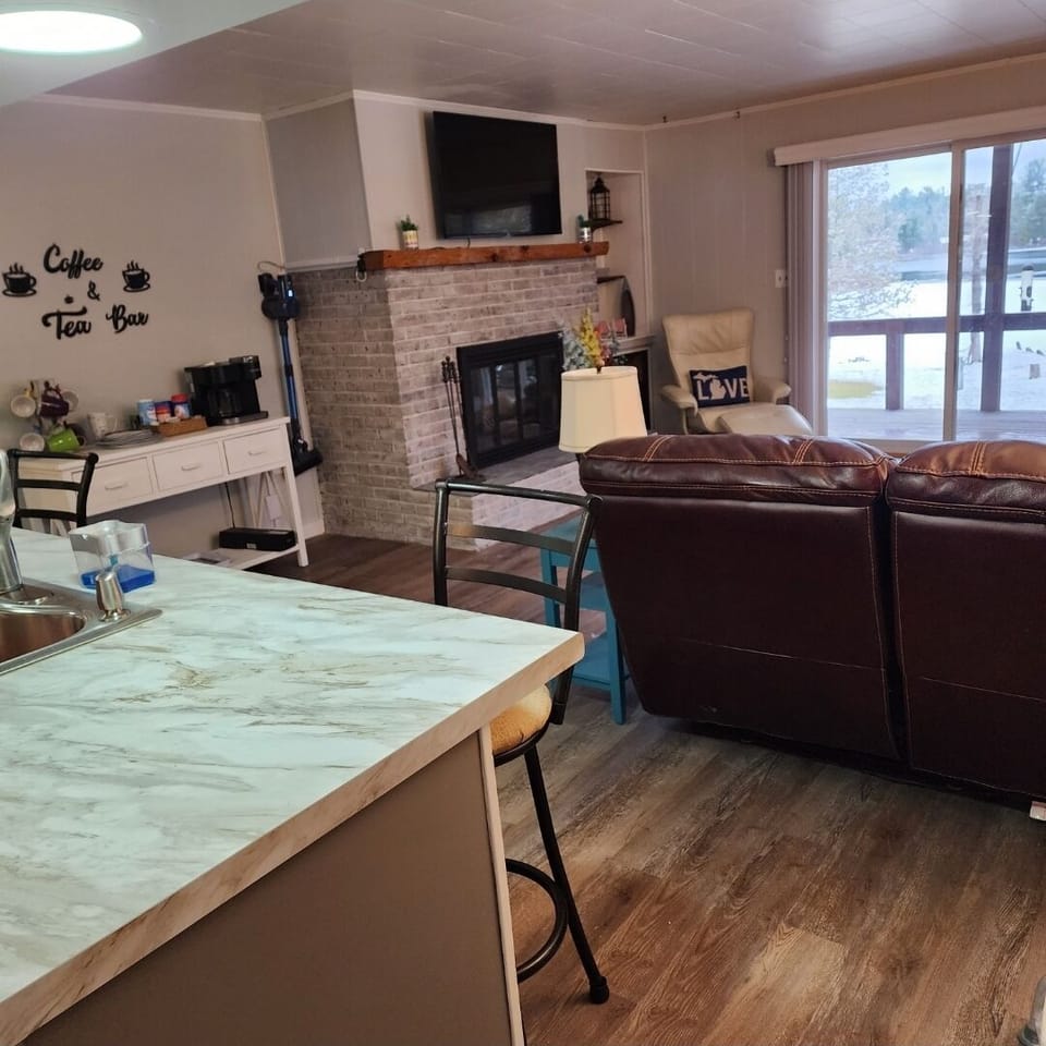 Upstairs kitchen goes into the living room. Overlooking the water.
