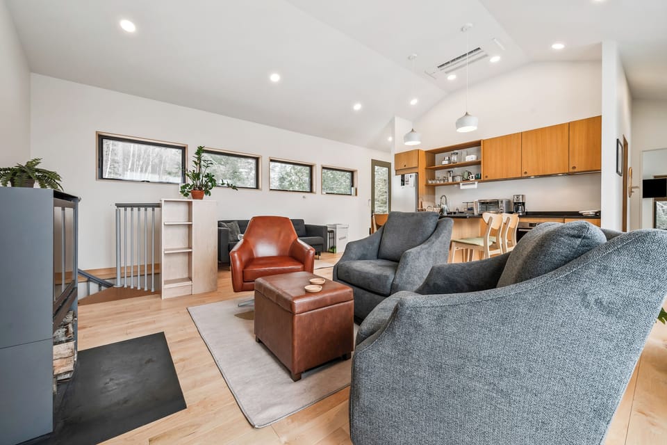 Living area and kitchen with stairs to lower level
