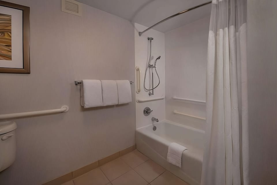 Soak and recharge with a clean tub-and-shower combo.