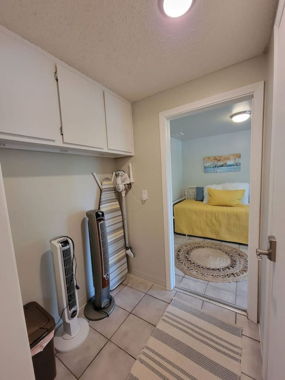Amenities including fans, iron, and ironing board