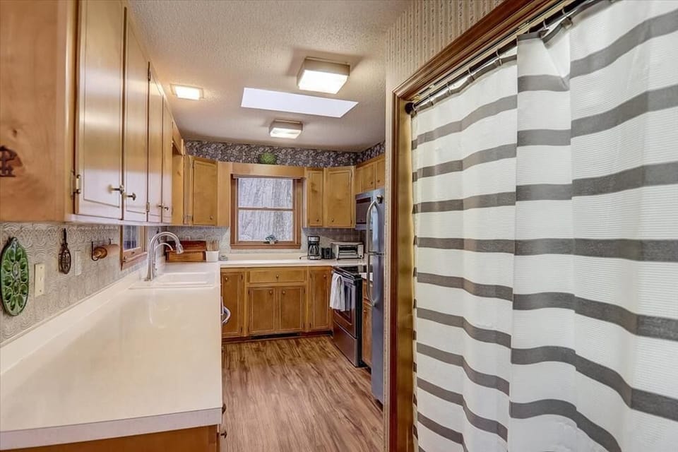 View into Kitchen Area with Laundry