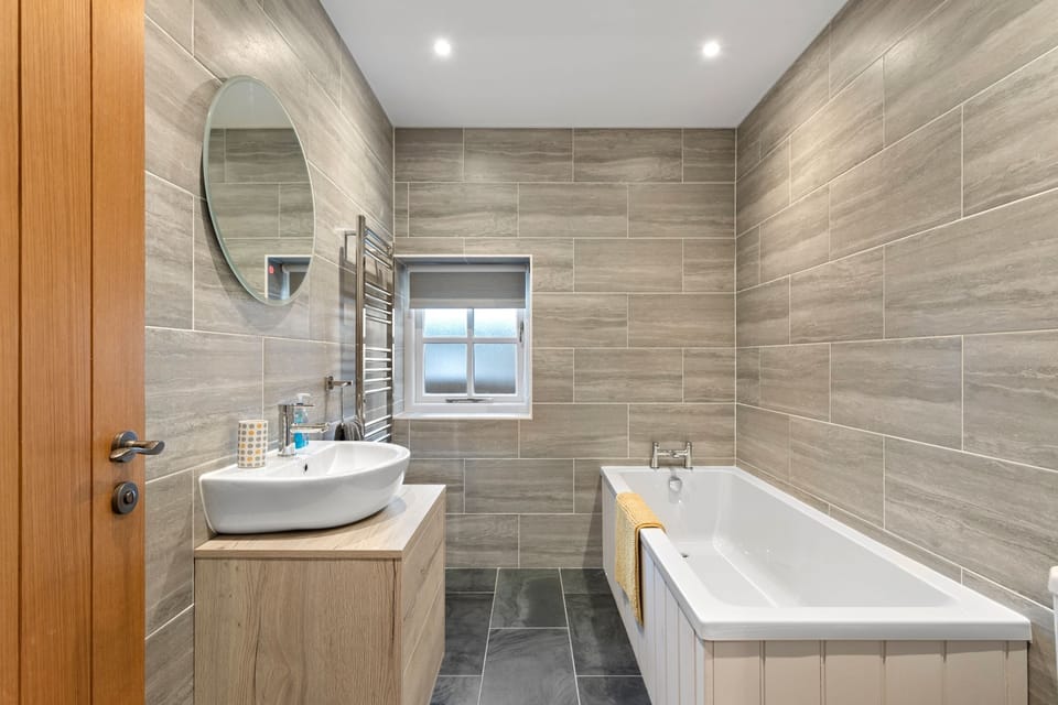 relax in the full size tub in the main bathroom