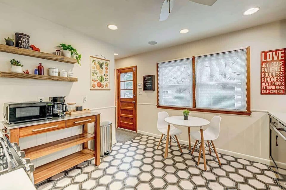 Fully equipped kitchen with coffee bar and 
 breakfast table