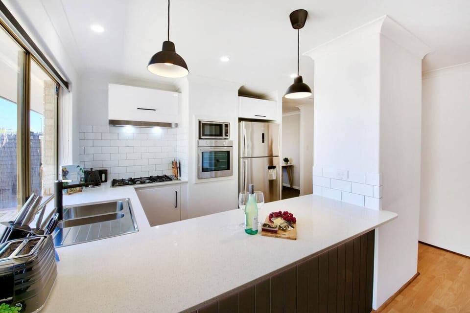 Kitchen with stainless steel appliances.