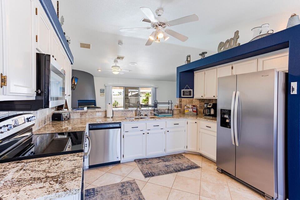 fully equipped kitchen, complete with stainless steel appliances and plenty of counter space.