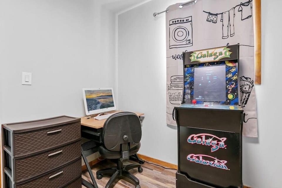 Office desk and chair with monitor and keyboard/mouse