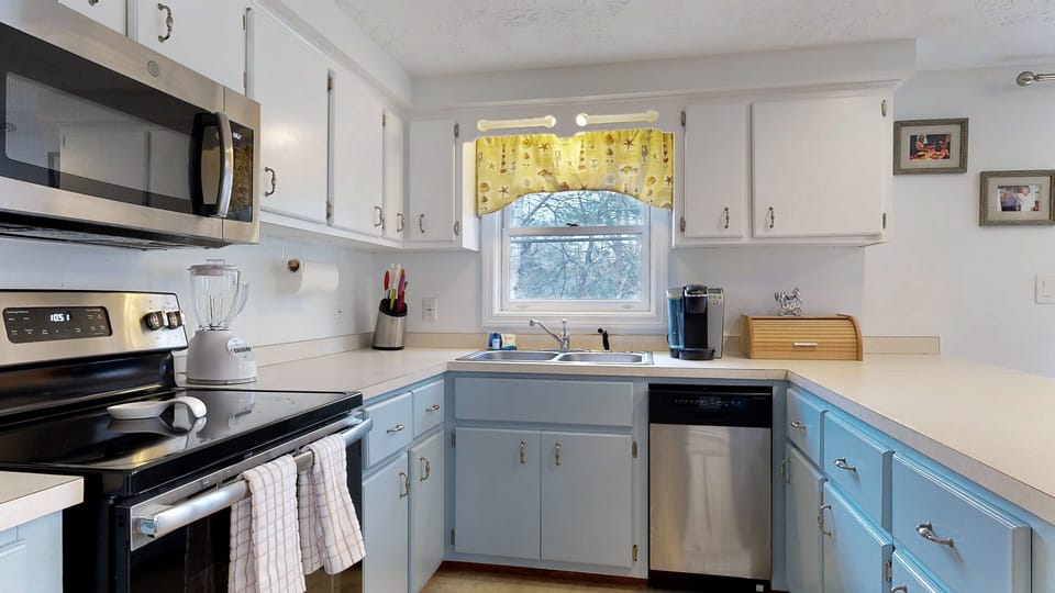 Fully equipped kitchen with stainless steel appliances