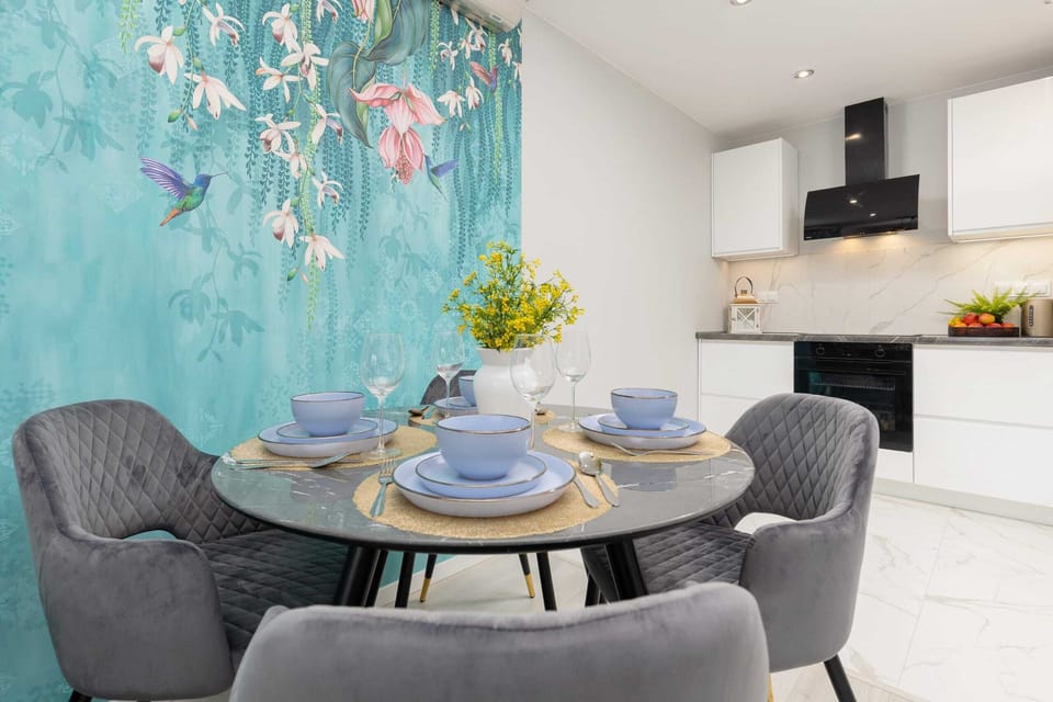 A dining area adjacent to the kitchen, with elegant decor and natural light.
