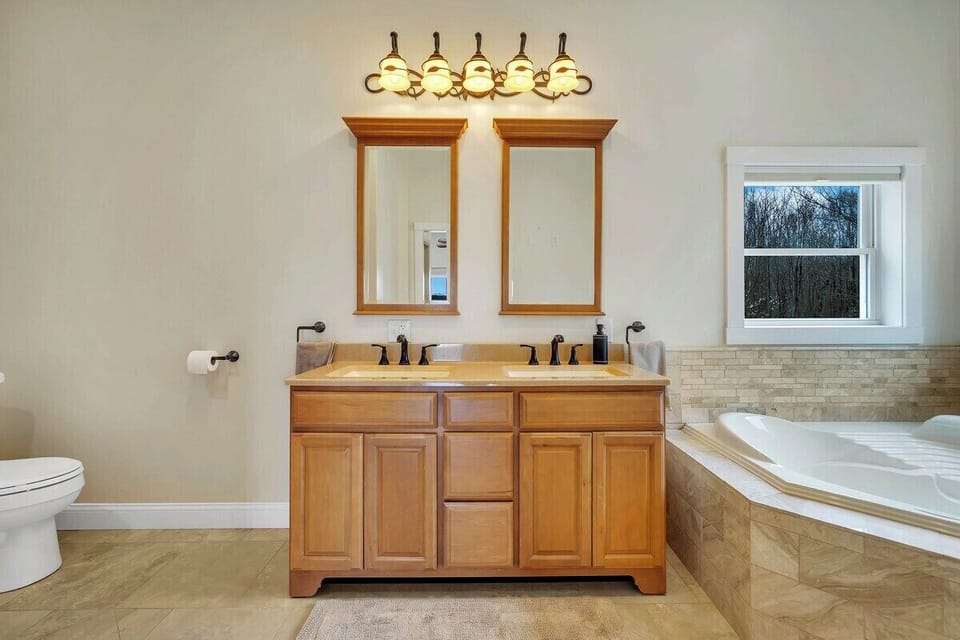 Master bath with soaking tub, double vanity and shower.