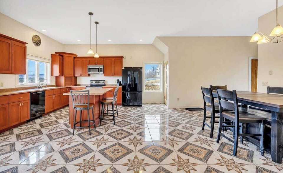 Large kitchen with lake views and dining area.