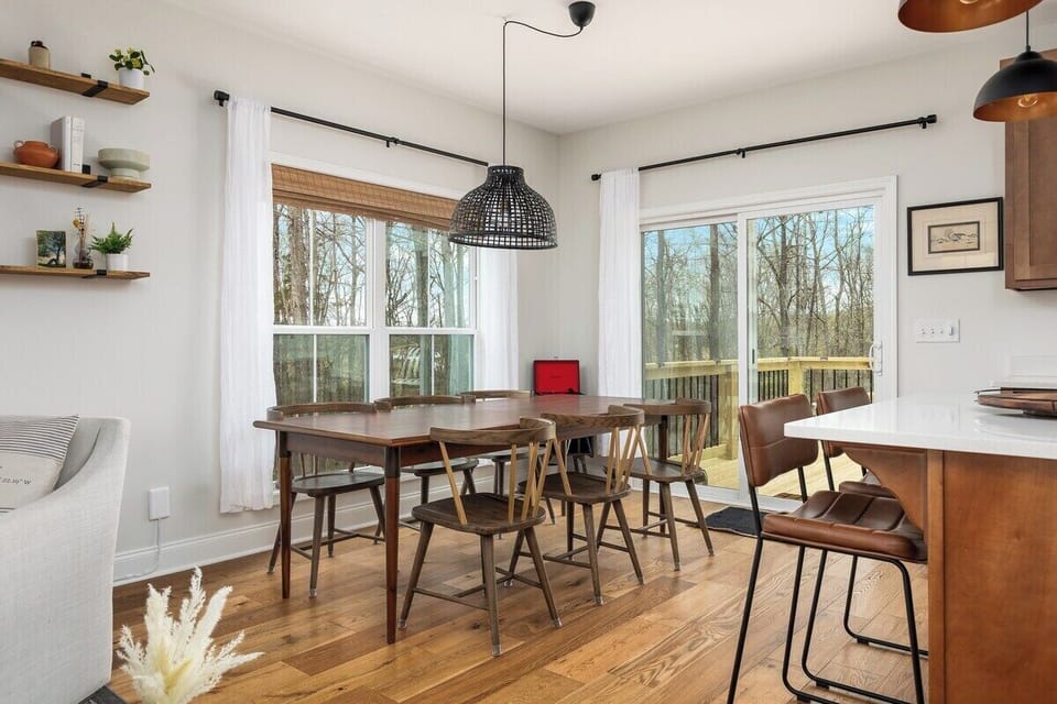 The dining room sits 6-8, the table expands - pull up the rolling white chairs for the end caps
2 bar stools 
A record player for nostalgic sounds, and a few records to enjoy