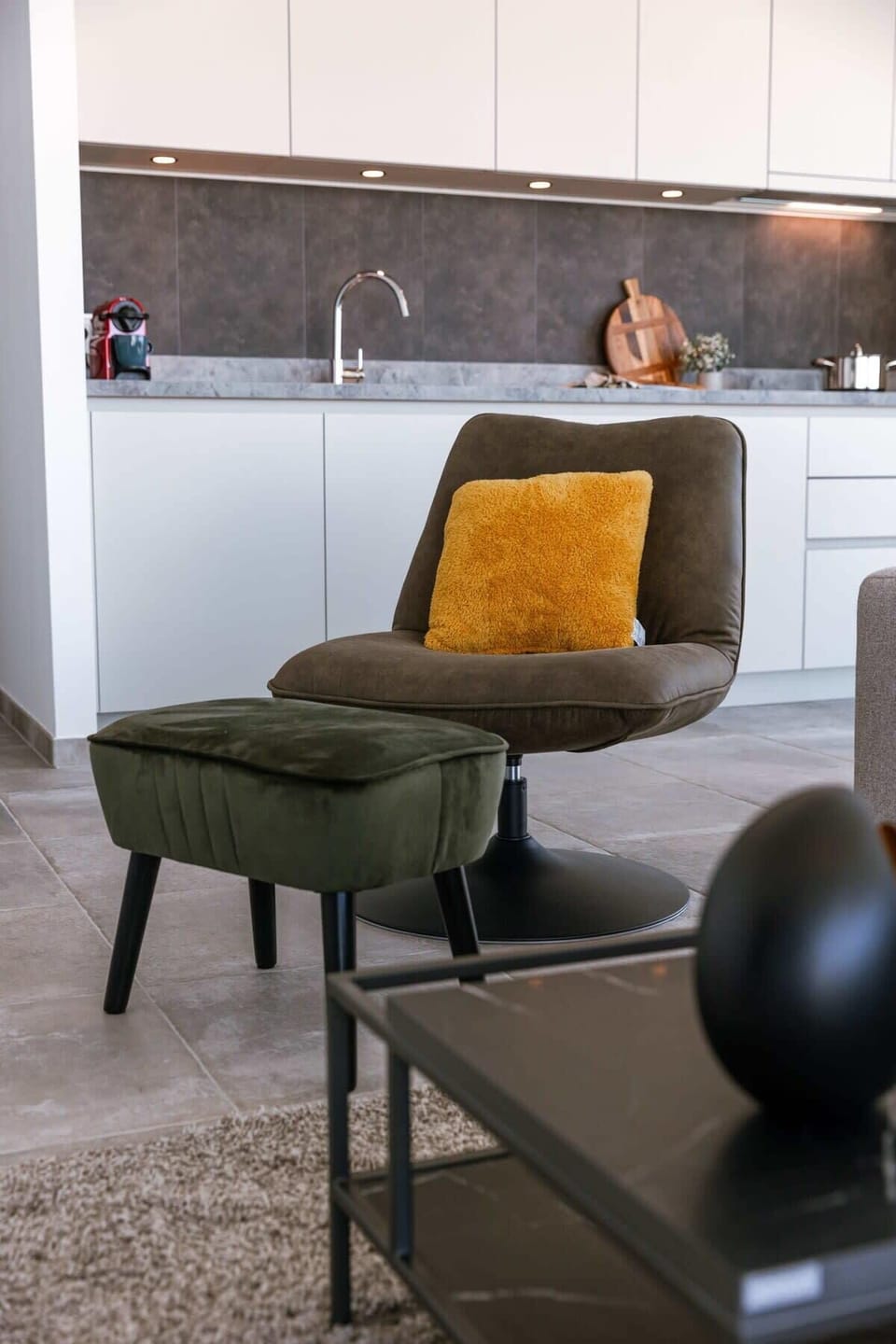 Reading corner — lamp, art, quiet pause.