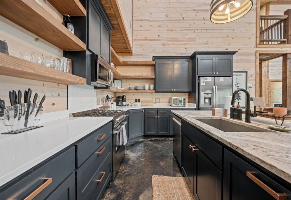 A chef's delight awaits in our state-of-the-art kitchen, where modern appliances meet rustic charm