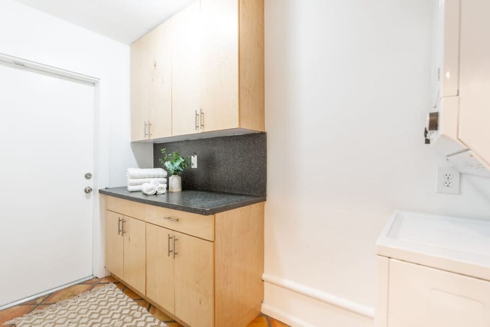 Counter space for folding laundry and access to rear patio