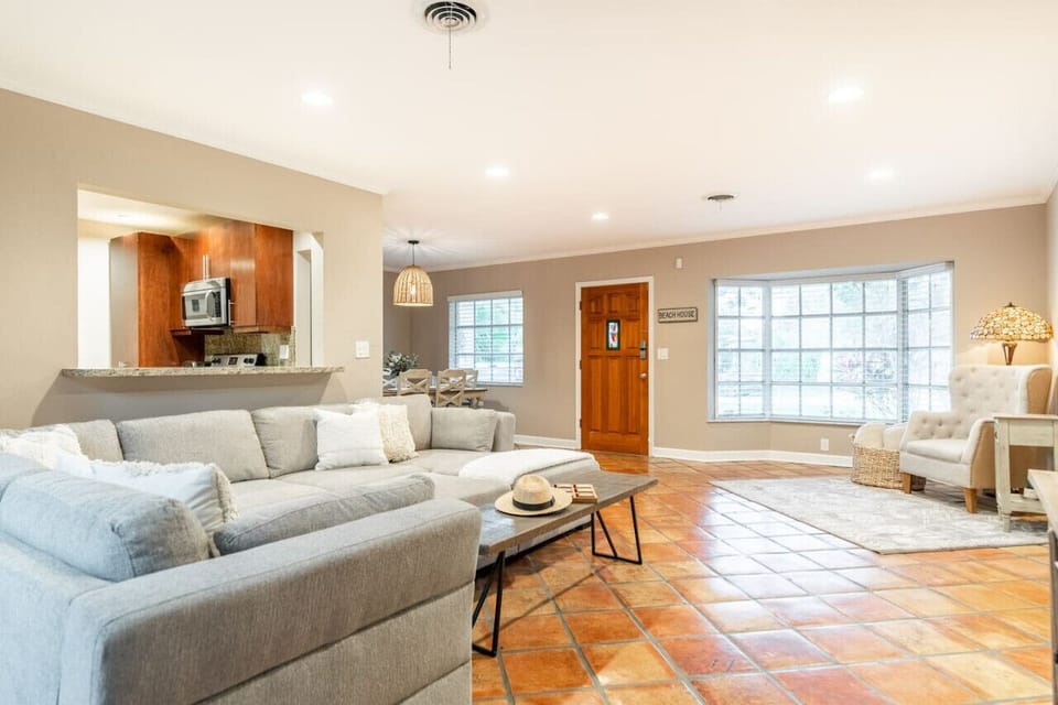 Open-concept living area with terracotta floors