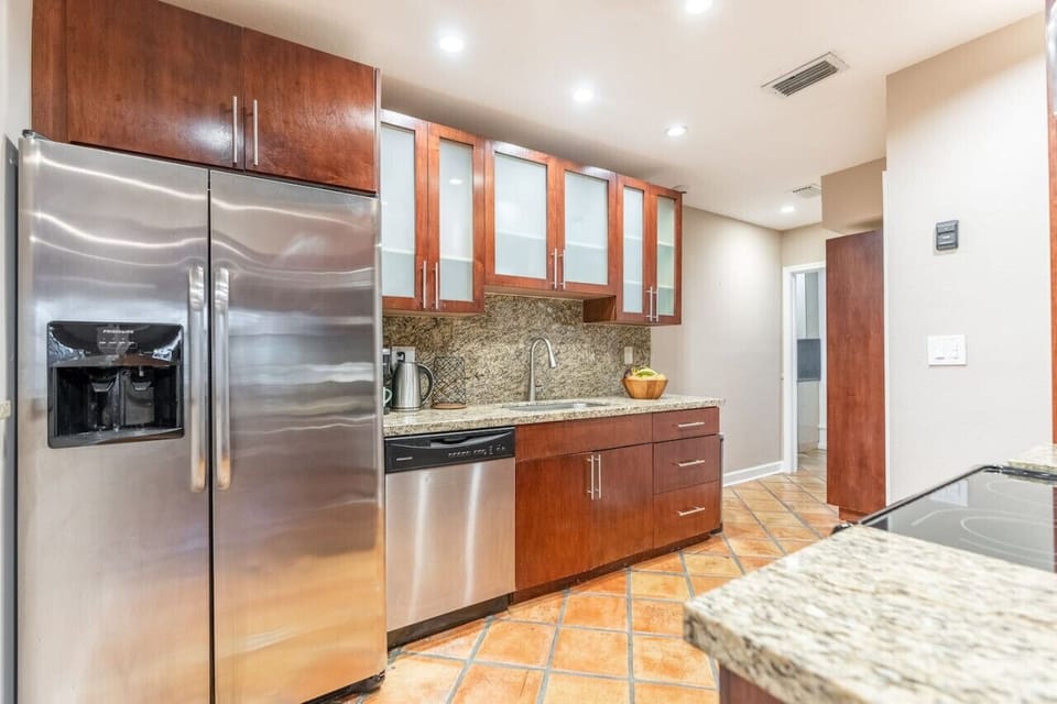 Modern kitchen with granite counters and stainless steel appliances