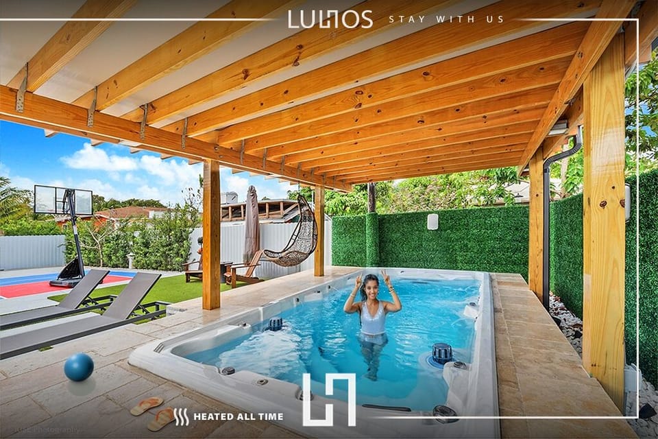 The Jacuzzi is surrounded by comfortable sun loungers