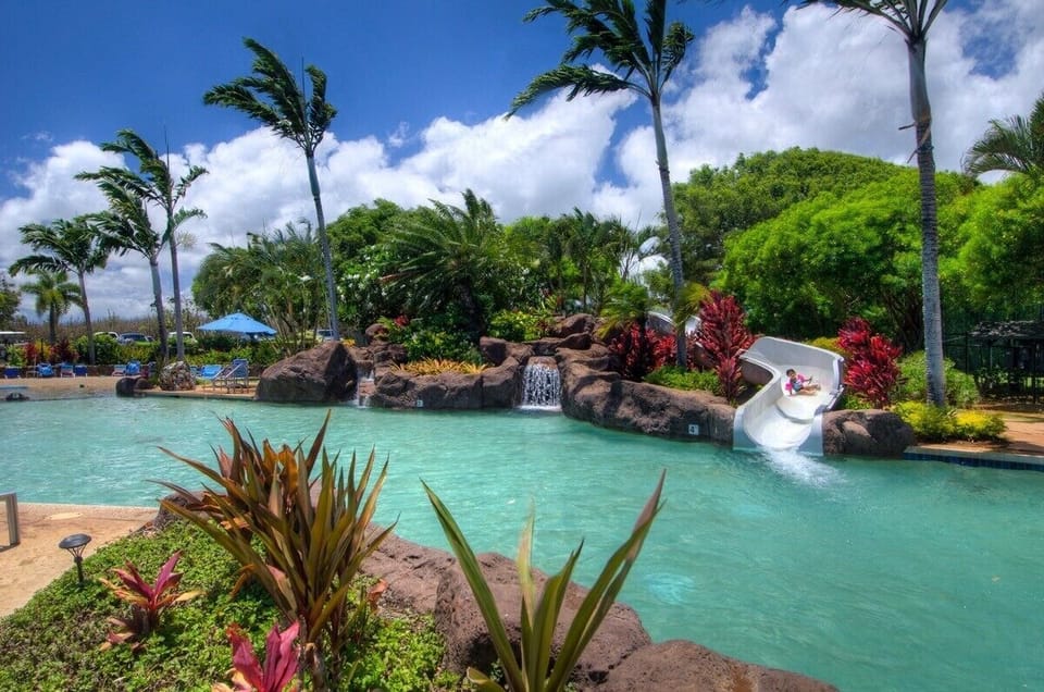Pool, gym, courts across the street - not next to the beach - fun slide for kids