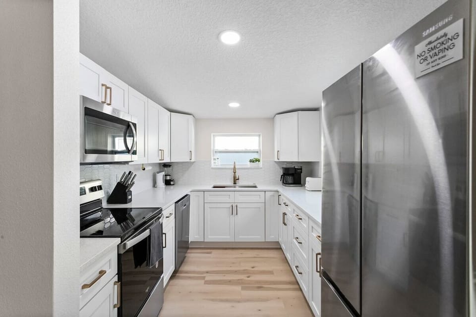 Brand new kitchen: all new stainless steel appliances, quartz countertop, champagne gold hardware and faucet.  Fully equipped with pots/pans, knives, silverware, glasses, mugs, dinnerware and so much more!