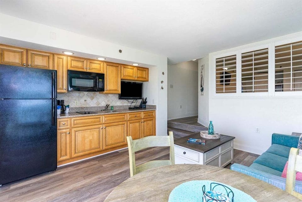 The open floor plan ensures that even while prepping a snack, you're never far from your loved ones.