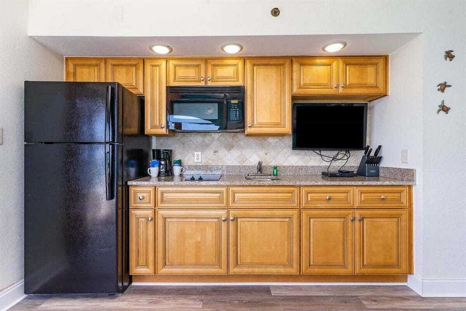 Stock the fridge with your favorite beach drinks and enjoy the convenience of a microwave and coffee maker.