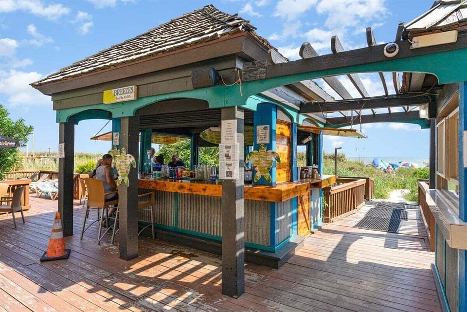 Enjoy a cool tropical beverage at the resort's vibrant on-site tiki bar.