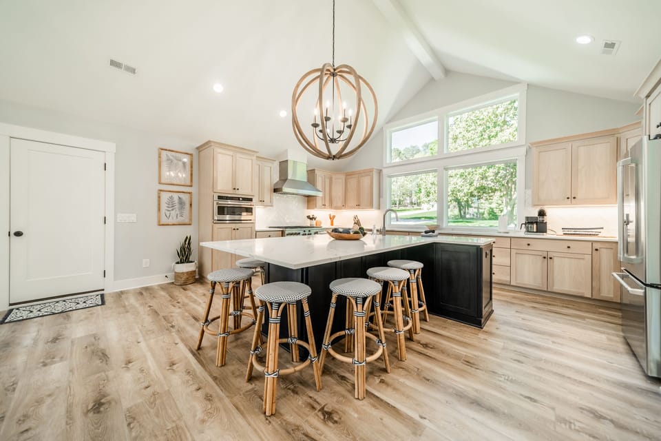 Modern, fully stocked kitchen with island seating for 6.