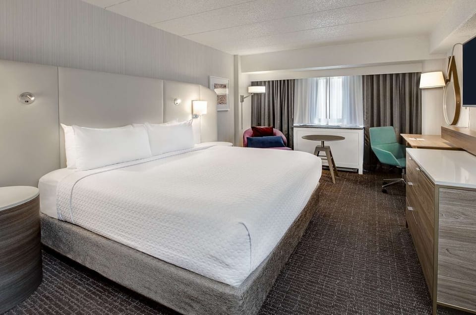 Unwind in a bright, spacious bedroom with plush king bed.