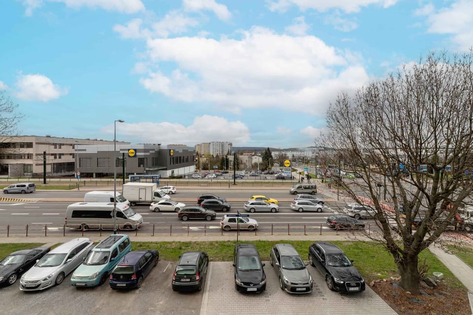 A parking area near the building, offering ample space and convenience for guests.
