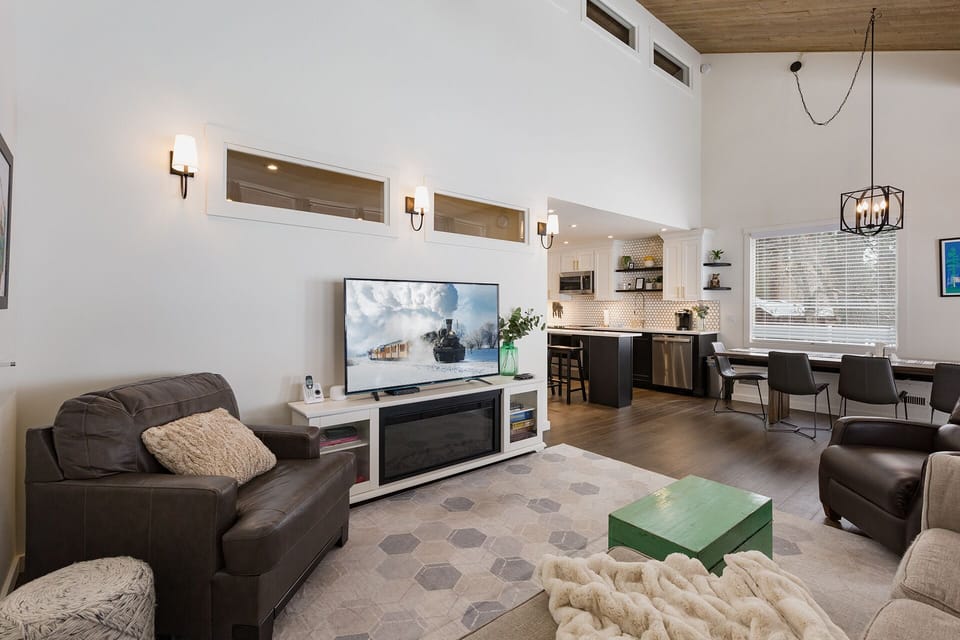 Living Room with High, Vaulted Ceilings and Smart TV
