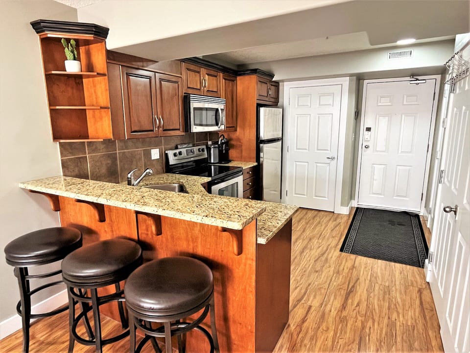 Nice, Fully Stocked Kitchen With Breakfast Bar!