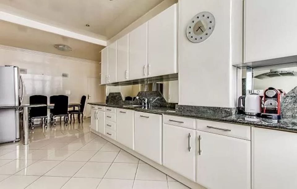 modern fully-equipped kitchen in a 4-bedroom Paris luxury apartment