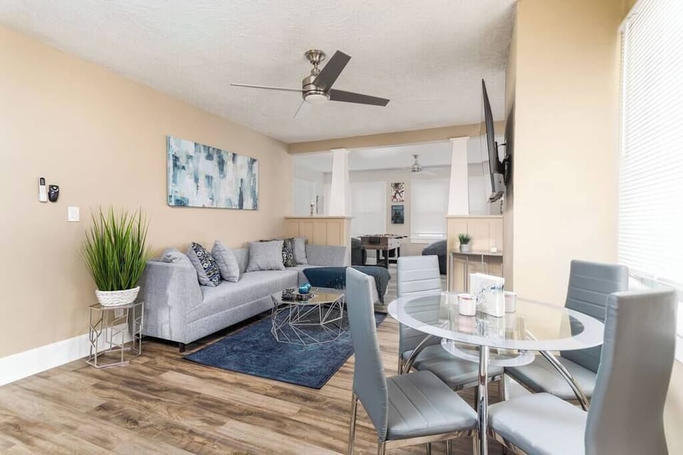Living room with  comfortable couch & dining table