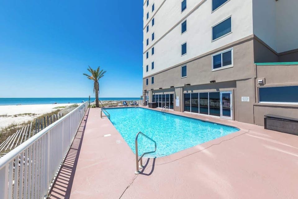 Relax in our outdoor pool with unobstructed views of Gulf State park, the beach, and fishing pier.