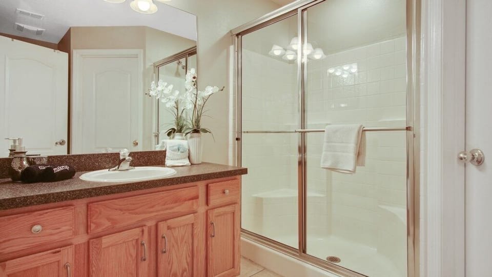 Bathroom 1 - En-suite off Bedroom 1 with walk in shower, sink, toilet, walk in closet
