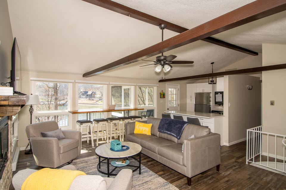 Front door view of living area with stunning view of cove and bar table!