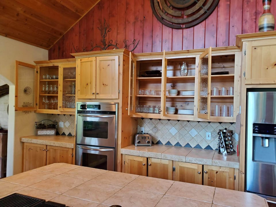 Fully stocked kitchen with 20+ place settings, special glassware.