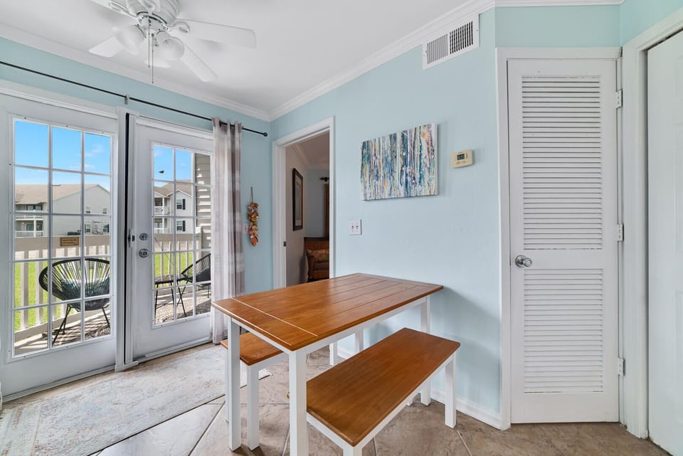 The cute dining area exudes warmth and character, providing a delightful spot for enjoying meals with loved ones and creating cherished memories in a cozy and inviting setting.