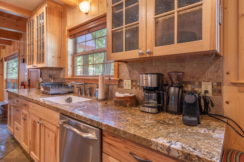 Well appointed kitchen with granite counter tops and stainless steel appliances.