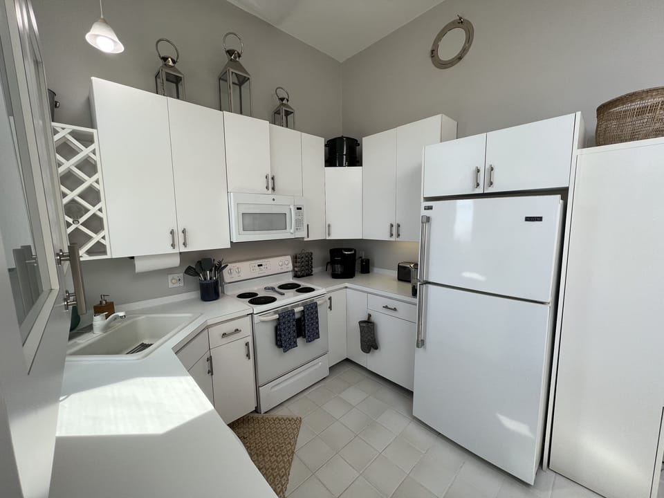 Kitchen includes Keurig K-Duo coffeemaker, Vitamix blender, and wine fridge.